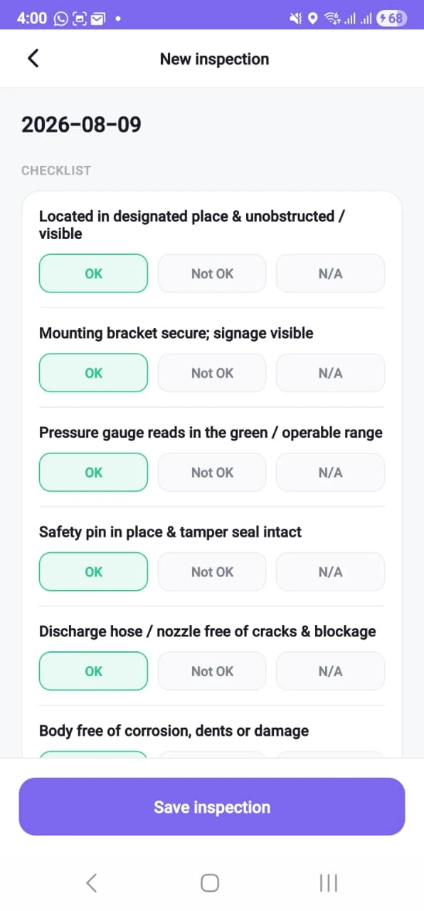 A new extinguisher inspection on a phone, dated 2026-08-09: checklist steps for location, mounting bracket, pressure gauge, safety pin, discharge hose and body condition, each offering OK, Not OK and N/A with OK pre-selected, above a save button